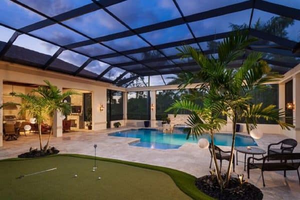 One of the best creative pool enclosure ideas is to create a space like this where nature blends seamlessly with the pool are