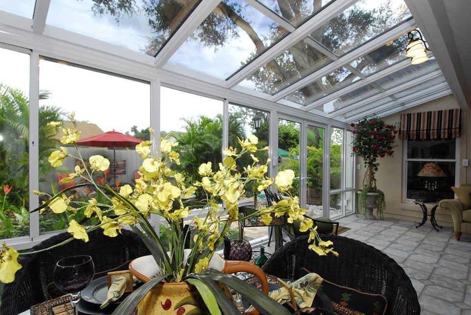 A picture of a flower and vase inside a beautiful sunroom installation in Myrtle Beach