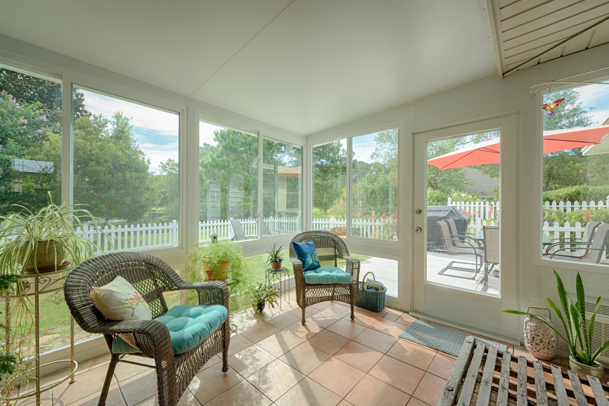 Using a sunroom for entertainment is a great idea to extend your space 