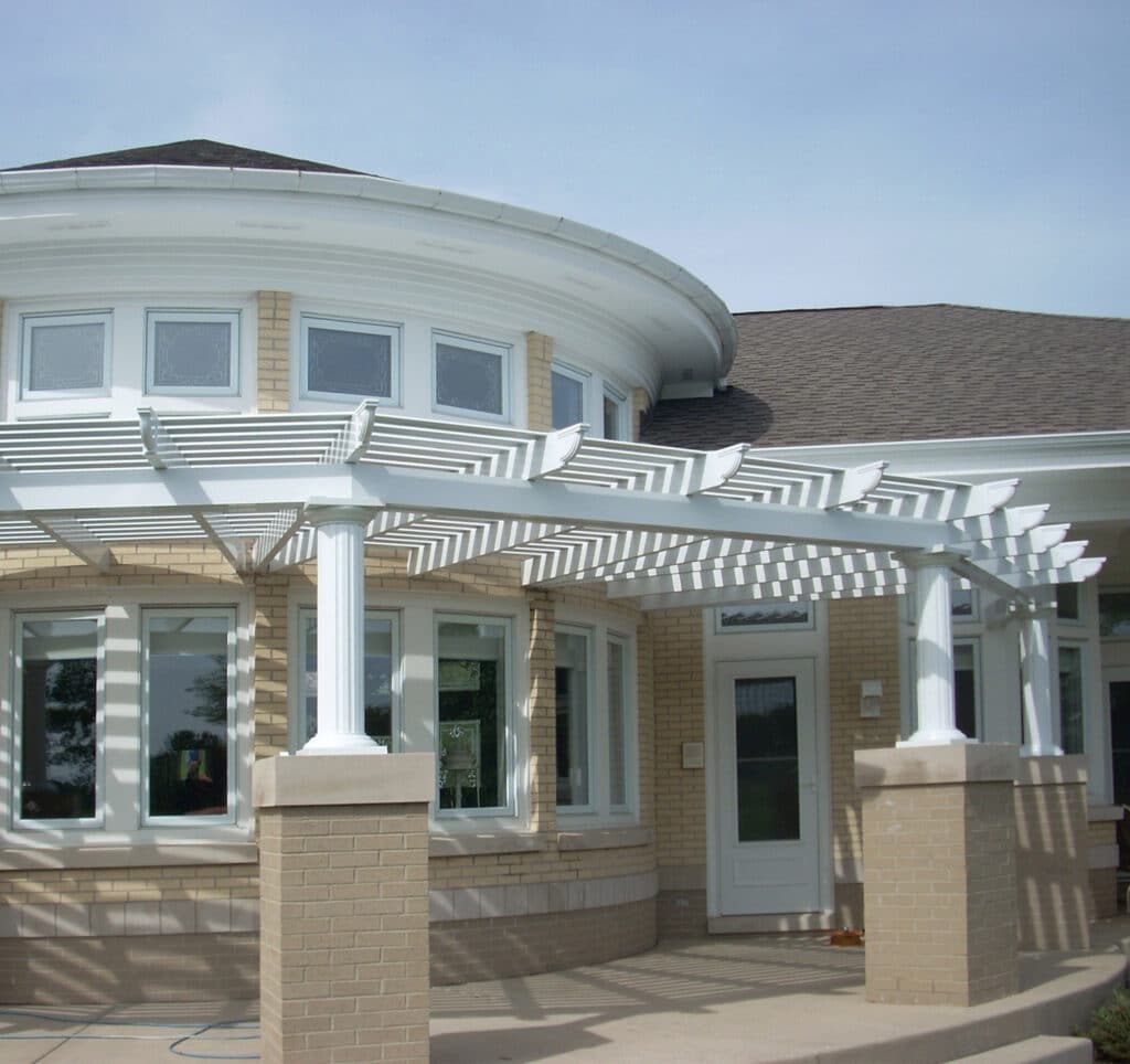 Attached pergolas can blend in with the architecture of your home and extend your outdoor living area.