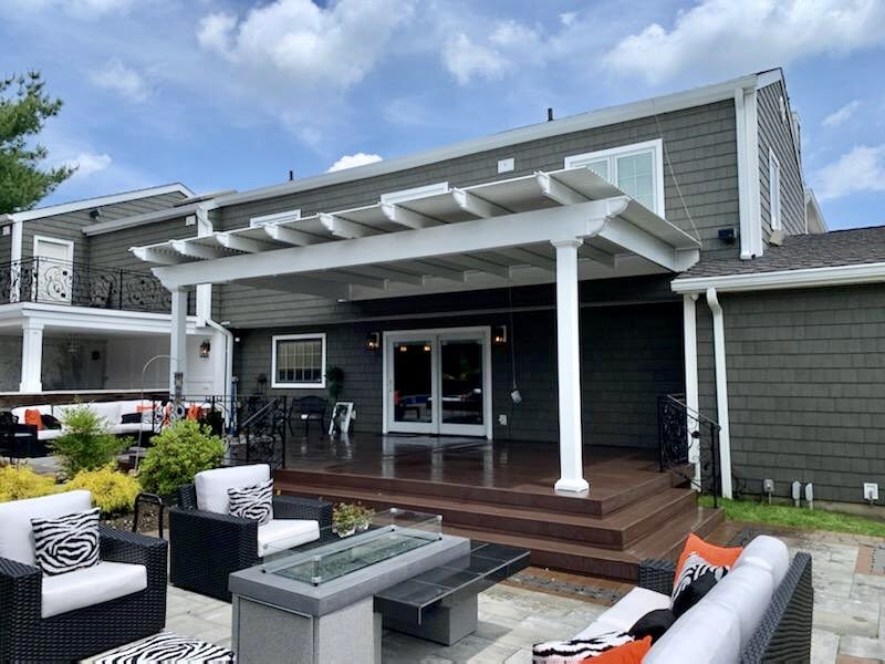 Attached pergolas can blend in with the architecture of your home and extend your outdoor living area.