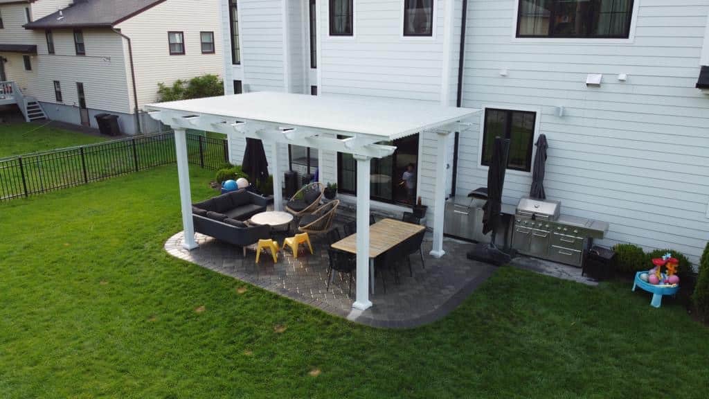 Attached pergolas can blend in with the architecture of your home and extend your outdoor living area.
