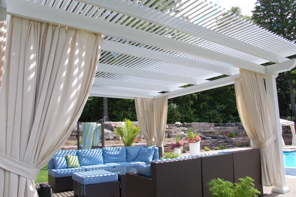 Pergolas can enhance your backyard by adding a bit of shade and protection to your backyard.