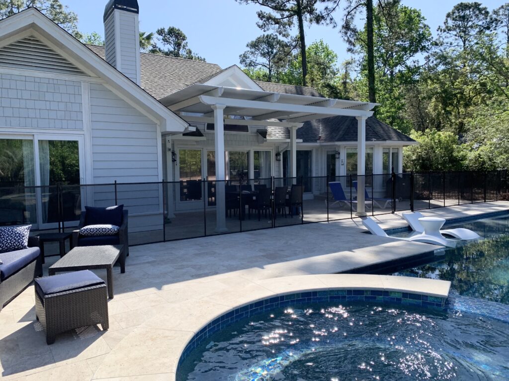Attached pergolas can blend in with the architecture of your home and extend your outdoor living area.