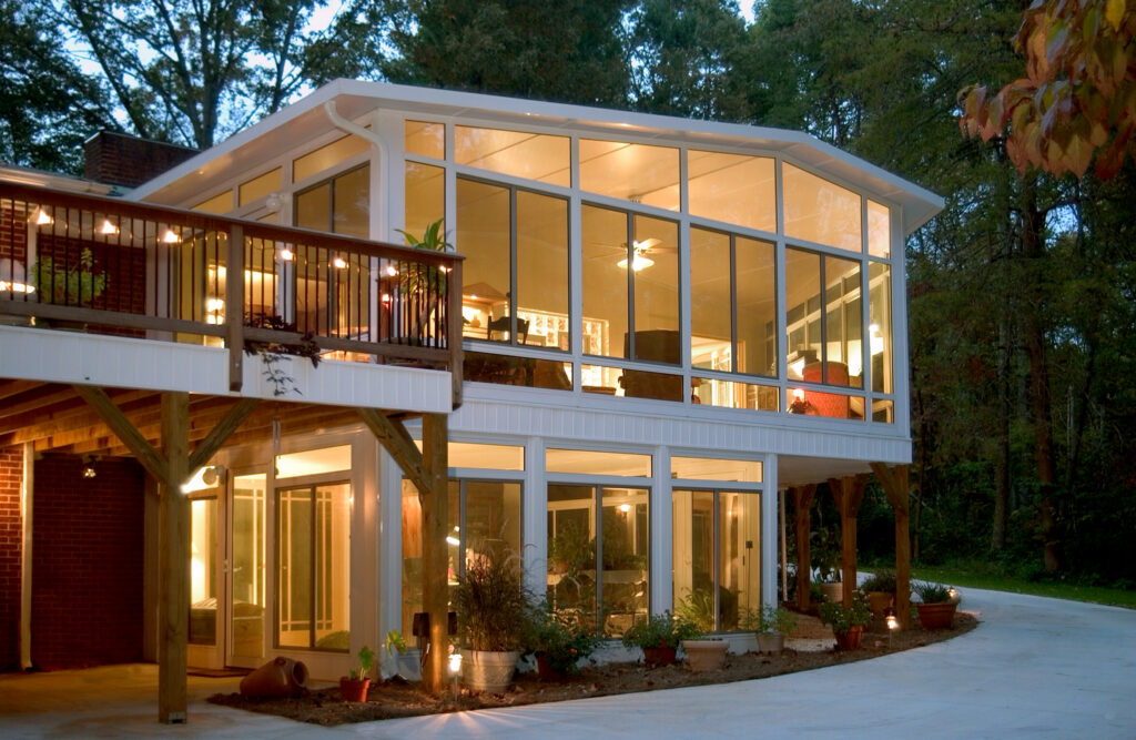 a photo showing a sunroom iluminated at night.