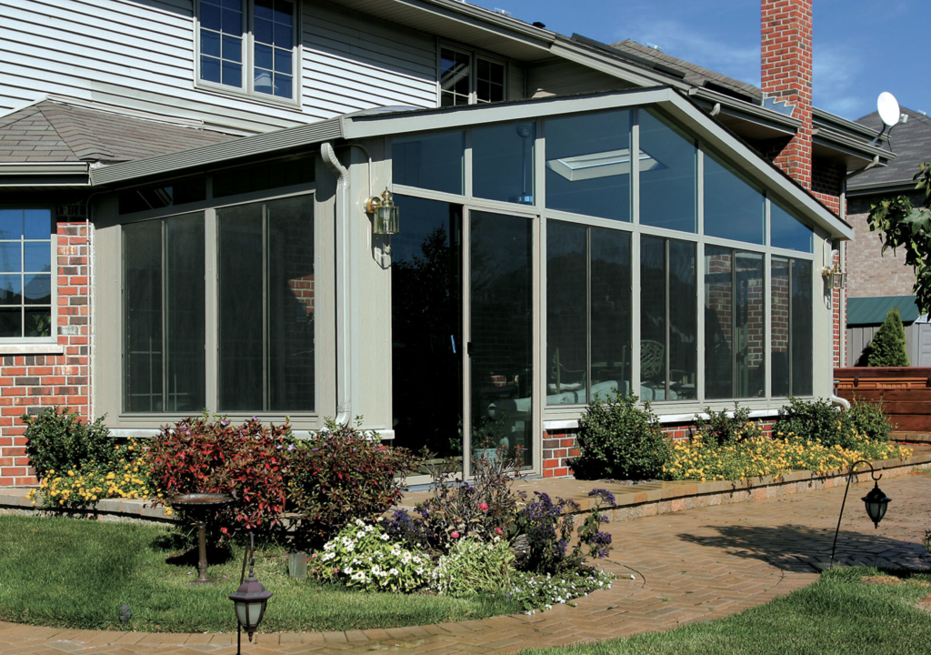 a photo of a sunroom in the day time